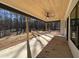 View of the covered back patio with a stained wood ceiling and ceiling fan overlooking the backyard at 34 Harmony Ridge Dr, Temple, GA 30179