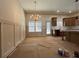 An open dining area features a chandelier and natural lighting, creating a welcoming atmosphere at 34 Harmony Ridge Dr, Temple, GA 30179