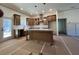 Open kitchen and living space with large island, ample counter space, and recessed lighting at 34 Harmony Ridge Dr, Temple, GA 30179