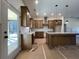 Bright kitchen featuring stone countertops, shaker cabinets, pendant lights, and stainless range hood at 34 Harmony Ridge Dr, Temple, GA 30179