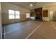A spacious living room features a stone fireplace and built-in shelving at 34 Harmony Ridge Dr, Temple, GA 30179