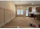 Living room with lots of natural light, classic wainscotting, and neutral walls at 34 Harmony Ridge Dr, Temple, GA 30179