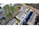 Stunning aerial view showcasing well-maintained townhome community with lush landscaping, convenient parking, and pond at 376 Provenance Dr, Atlanta, GA 30328