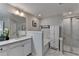 Beautiful bathroom featuring double sinks, shower, and soaking tub with great fixtures and white cabinets at 376 Provenance Dr, Atlanta, GA 30328