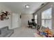 Spare bedroom with two windows, desk, and neutral carpeting at 376 Provenance Dr, Atlanta, GA 30328