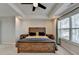 Main bedroom with a rustic bed frame, ensuite bathroom, and vaulted ceilings at 376 Provenance Dr, Atlanta, GA 30328