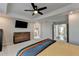 Main bedroom with ensuite bathroom, vaulted ceilings, and TV at 376 Provenance Dr, Atlanta, GA 30328