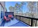 Outdoor deck featuring seating, a small table, and string lights at 376 Provenance Dr, Atlanta, GA 30328