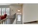 Bright entryway with a pendant light and stairs at 376 Provenance Dr, Atlanta, GA 30328