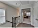 Hallway with hardwood floors and black railing at 376 Provenance Dr, Atlanta, GA 30328