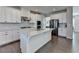 Kitchen features white cabinets, quartz countertops and stainless steel appliances at 376 Provenance Dr, Atlanta, GA 30328
