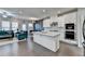 Modern kitchen features white cabinets, a large island, and stainless steel appliances at 376 Provenance Dr, Atlanta, GA 30328