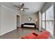 Bright living room with hardwood floors, a ceiling fan, and large windows at 376 Provenance Dr, Atlanta, GA 30328