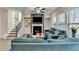 Bright living room with a fireplace, TV, and comfortable blue sofas at 376 Provenance Dr, Atlanta, GA 30328