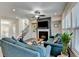 Bright and airy living room with a fireplace, TV, and comfortable sofas at 376 Provenance Dr, Atlanta, GA 30328