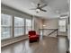 Spacious loft with hardwood floors, natural light, and a view of the staircase at 376 Provenance Dr, Atlanta, GA 30328