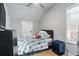 Bedroom features wood flooring, a bed, window providing natural light and neutral walls at 1174 Princess Sw Ave, Atlanta, GA 30310