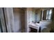 Functional bathroom with a shower and sink; needs some updates to modernize at 868 Maxey Hill Ct, Stone Mountain, GA 30083