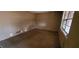 A corner bedroom with a window needing minor renovations at 868 Maxey Hill Ct, Stone Mountain, GA 30083