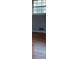 A bright room with window and hardwood floors, providing a cozy and sunlit atmosphere at 868 Maxey Hill Ct, Stone Mountain, GA 30083
