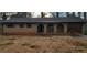 Quaint brick home featuring arched entryway and attached garage at 868 Maxey Hill Ct, Stone Mountain, GA 30083