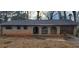 Quaint brick home featuring arched entryway and attached garage at 868 Maxey Hill Ct, Stone Mountain, GA 30083