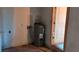 Utility Room with water heater, door, and electrical outlet at 868 Maxey Hill Ct, Stone Mountain, GA 30083