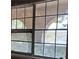 A dirty window shows an aging exterior of the home at 868 Maxey Hill Ct, Stone Mountain, GA 30083
