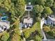 Aerial view of home highlighting the pool, driveway, and manicured lawn at 9435 Grande Dr, Winston, GA 30187