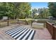 Wooden deck featuring ample space for seating, perfect for relaxation and enjoying the outdoor ambiance at 9435 Grande Dr, Winston, GA 30187