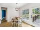 Bright dining area with hardwood floors, natural light, and door to the backyard at 9435 Grande Dr, Winston, GA 30187