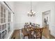 Formal dining room featuring hardwood floors, large windows, and detailed trim at 9435 Grande Dr, Winston, GA 30187
