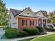 Charming brick home featuring a well-manicured lawn, covered porch, and classic architectural details at 9435 Grande Dr, Winston, GA 30187
