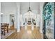 Elegant entryway featuring hardwood floors, arched doorways, and views into the spacious living room at 9435 Grande Dr, Winston, GA 30187
