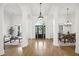 Spacious entry featuring hardwood floors, arched entryways, and pendant lighting at 9435 Grande Dr, Winston, GA 30187