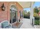 Charming front porch with brick exterior, decorative lanterns, and a welcoming entrance at 9435 Grande Dr, Winston, GA 30187
