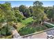 Lush front yard with mature trees and a well-maintained lawn in a serene neighborhood at 9435 Grande Dr, Winston, GA 30187