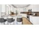 Well-lit kitchen with granite countertops, stainless appliances, and bar seating at 9435 Grande Dr, Winston, GA 30187