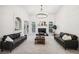 Bright living room with fireplace, gray sofas, and a contemporary chandelier at 9435 Grande Dr, Winston, GA 30187