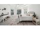 Serene main bedroom with a tray ceiling, calming decor, and lots of natural light at 9435 Grande Dr, Winston, GA 30187
