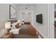 Cozy bedroom featuring two beds, modern decor, and mounted flat-screen television at 733 Frederica Ne St # 7, Atlanta, GA 30306