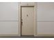 Front door of unit 7 with neutral paint and a peephole, providing a secure entry at 733 Frederica Ne St # 7, Atlanta, GA 30306