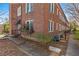 Charming brick building with landscaped front and wooden walkway leading to entrance at 733 Frederica Ne St # 7, Atlanta, GA 30306