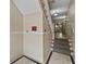 Interior hallway with staircase and tile flooring, showing a clean and welcoming entrance at 733 Frederica Ne St # 7, Atlanta, GA 30306