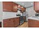 Modern kitchen with stainless steel appliances, white countertops, and wooden cabinets at 733 Frederica Ne St # 7, Atlanta, GA 30306