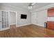 Open living area with hardwood floors, wall-mounted TV, and view to another room at 733 Frederica Ne St # 7, Atlanta, GA 30306