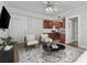 Living room with hardwood floors, seating and an open kitchen with stainless appliances at 733 Frederica Ne St # 7, Atlanta, GA 30306