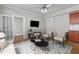 Living room with hardwood floors, view to another room, TV, and open kitchen at 733 Frederica Ne St # 7, Atlanta, GA 30306