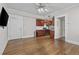 Open-concept living room with hardwood floors and access to a modern kitchen at 733 Frederica Ne St # 7, Atlanta, GA 30306