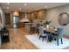 Contemporary kitchen and dining area with stainless steel appliances, island, and hardwood floors at 1395 Winburn Dr, East Point, GA 30344